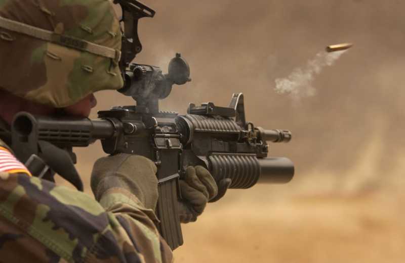 a-shell-casing-flies-out-with-a-trail-of-smoke-as-u-s-army-pfc-michael-freise-fires-an-m-4-rifle-during-a-reflex-firing-exercise-at-the-rodriguez-live-fire-complex-republic-of-.jpg