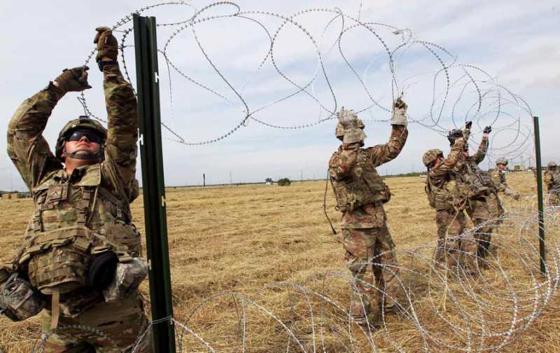 border-troops-barbed-wire-rtr-img.jpg